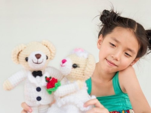 How is playing with dolls beneficial?