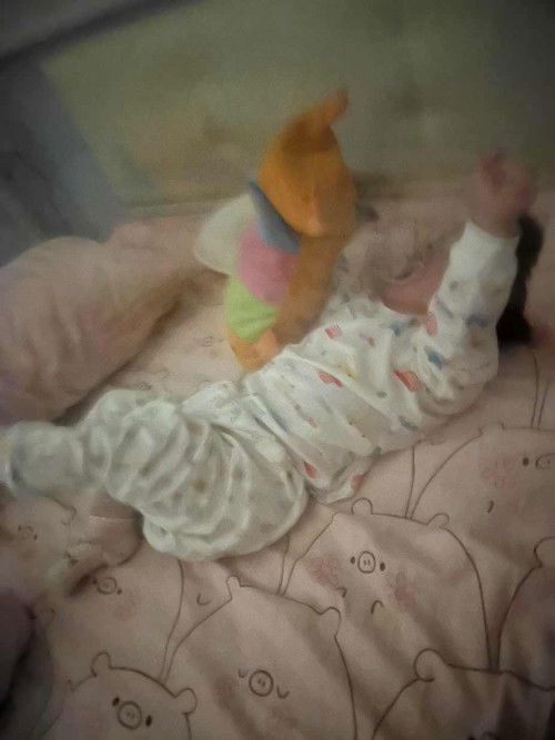 Stiff leg & clench fist/ grabbing things very tightly when lying on her back