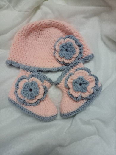 Handmade crochet baby booties and beanie.