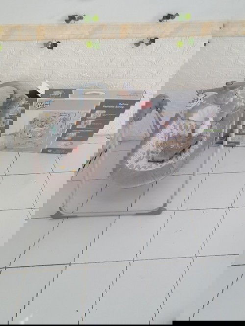 Preloved right start deluxe swing