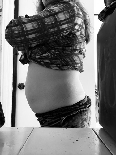 Baby bump or love handles?