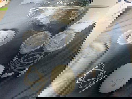 FOR SALE: Breast pump with free milk catcher