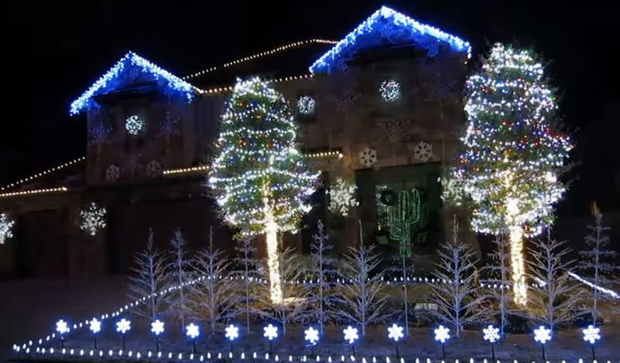 Christmas decorations light up to Frozen's "Let it Go"