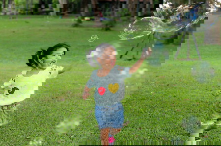 Smile asian baby girl play bubble balloon