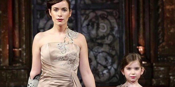 Model with bionic arm walks NYFW runway with her 'mini-me'