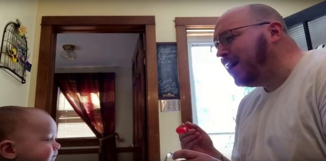 Dad gets his baby to eat food by singing