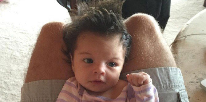 Baby's lush hair, beautiful blue eyes are breaking the internet