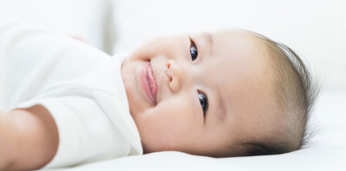 Your newborn baby's very first smile