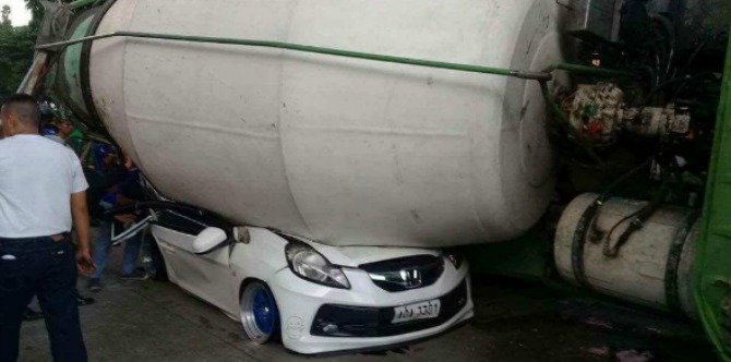 Car carrying family of 5 crushed by overturned cement mixer, father killed