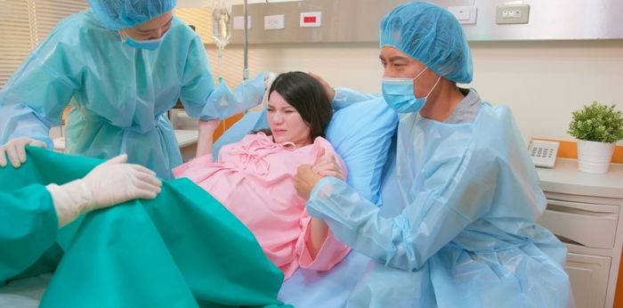 7 labor positions that might help you to ease pain during labor and their pros and cons