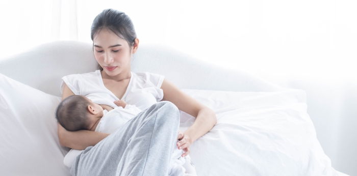 What should I know about waking my baby to feed?