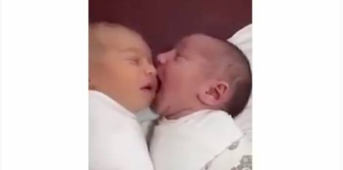 Cute baby playing with sibling