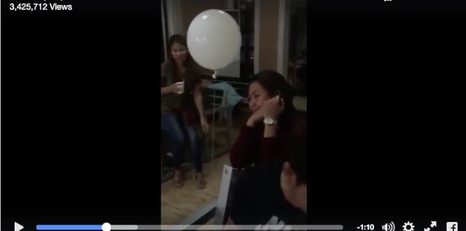 White balloon "hugs" grieving mother during a child's wake