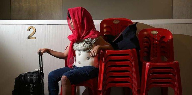 Maid escapes employers by jumping into the garbage chute