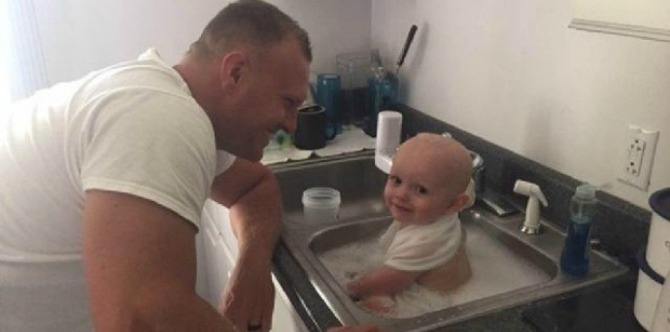 Police officers takes care of baby they found in vomit