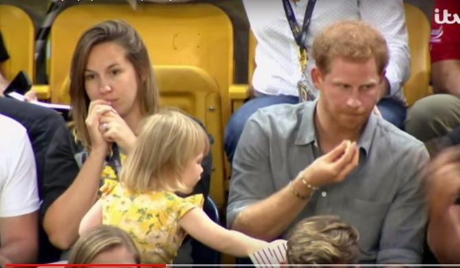 Cheeky toddler sneakily swipes Prince Harry's popcorn