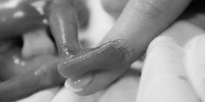 A stillborn baby was thrown out with hospital laundry and his heartbroken mum seeks justice