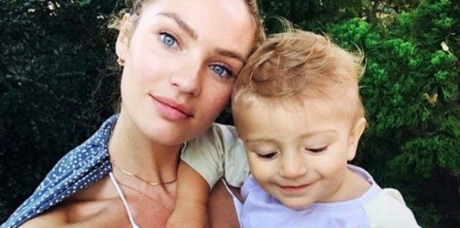 Victoria's Secret model Candice Swanepoel walks the runway with a baby bump