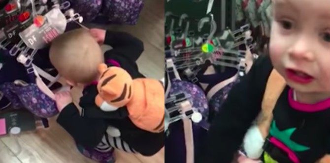 Thirsty toddler adorably searches for milk in a shop's bra section!