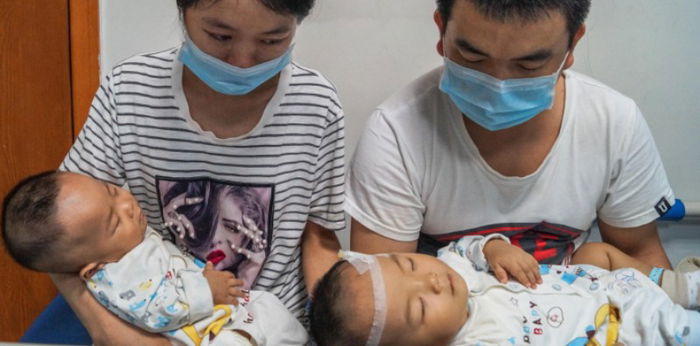 Heartbroken parents of twins forced to draw lots to decide which twin will live...