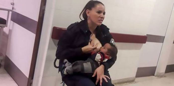 Police officer breastfeeds hungry baby who was called 'smelly and dirty'