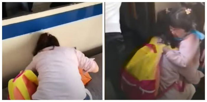 Phone obsessed mum fails to see daughter falling on train tracks