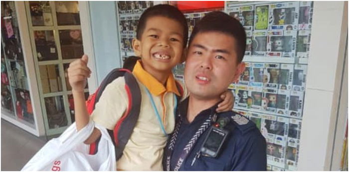 Kind Singapore policeman finds lost child at shopping mall, gifts him a toy