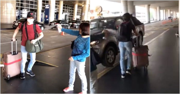 Mum Welcomes Son At Airport By Dousing Him In Disinfectant