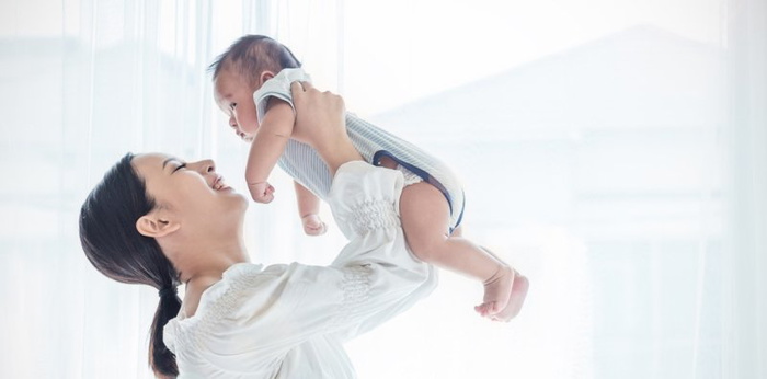 mum holding her baby up