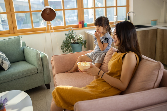 mum and daughter watching TV