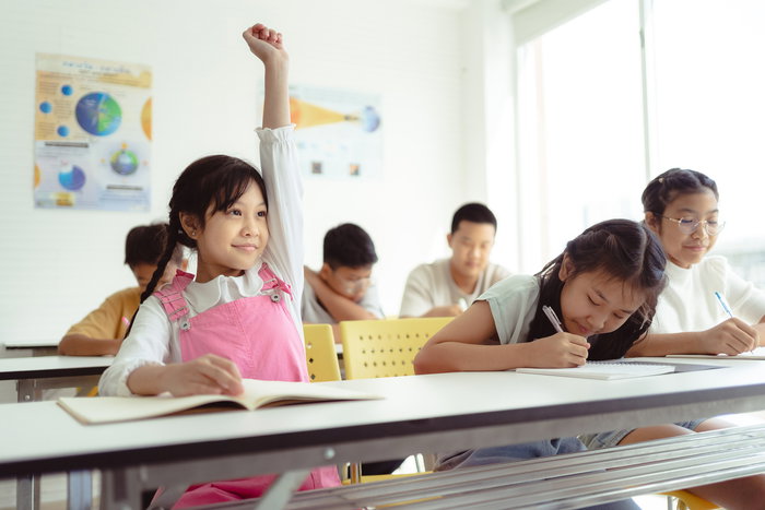 Child concentrating on daily maths practice at home