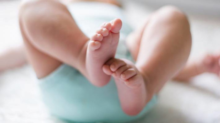 breastfeeds baby